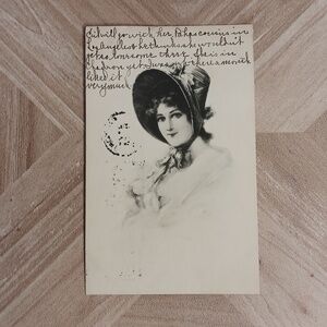 Antique 1911 postcard with picture of woman in bonnet